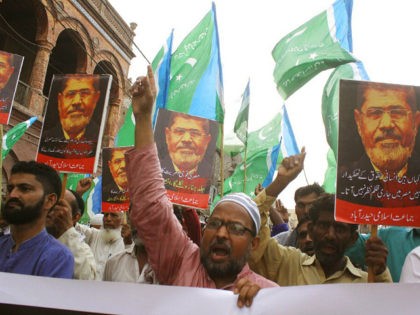 Supporters of the Pakistani religious party Jamaat-i-Islami, chant slogans for ousted former Egyptian President Mohammed Morsi in Hyderabad, Pakistan. Tuesday, June 18, 2019. Morsi, Egypt's first democratically elected president ousted by the military in 2013, collapsed during a trial session in Cairo on Monday and died. (AP Photo/Pervez Masih)