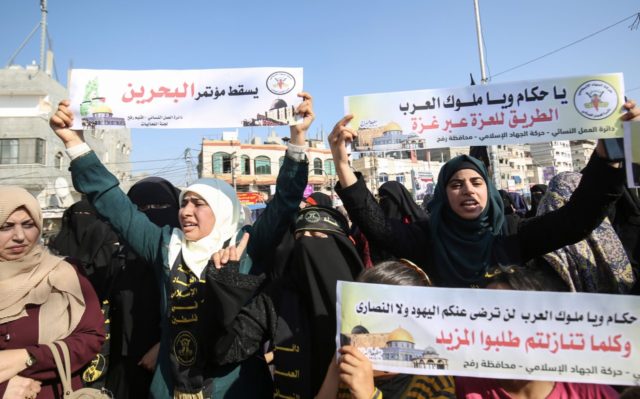 Palestinian female supporters of the Islamic Jihad protest against the Bahrain economic workshop in the southern Gaza Strip town of Rafah on June 18, 2019. - Israel will attend an upcoming conference on the economic aspects of Washington's peace plan aimed at resolving the Israeli-Palestinian conflict, Foreign Minister Israel Katz …