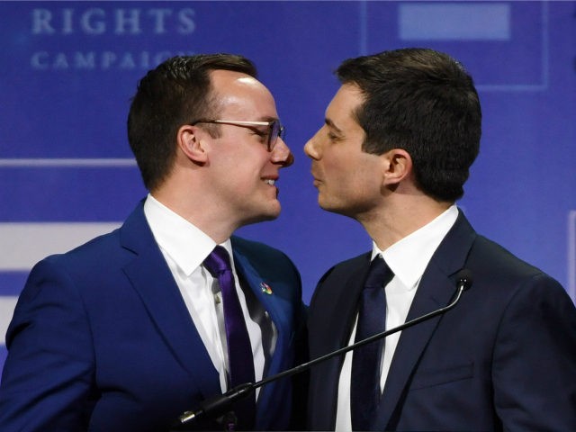 Chasten Glezman Buttigieg (L) kisses his husband, South Bend, Indiana Mayor Pete Buttigieg, after he delivered a keynote address at the Human Rights Campaign's (HRC) 14th annual Las Vegas Gala at Caesars Palace on May 11, 2019 in Las Vegas, Nevada. Buttigieg is the first openly gay candidate to run …