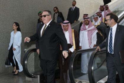 US Secretary of State Mike Pompeo (C-L) with Saudi Minister of State for Foreign Affairs Adel al-Jubeir (2nd-C) get off of an escalator at the airport as Pompeo prepares to depart Jeddah, on June 24, 2019. - Pompeo travelled to meet with Saudi leaders today to build a "global coalition" …