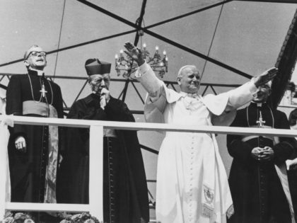 Pope John Paul II waving to the crowd gathered in front of the Jasna Gora Monastery, during his visit to Poland, June 1979. (Photo by Keystone/Hulton Archive/Getty Images)