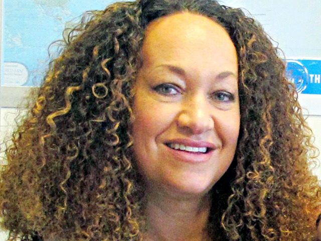 In this March 20, 2017, file photo, Nkechi Diallo, then known as Rachel Dolezal, poses for a photo in Spokane, Wash. The former NAACP leader in Washington state whose life unraveled in 2015 after she was exposed as a white woman pretending to be black has reached an agreement to …
