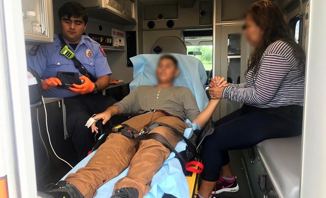 Eagle Pass Fire Department ambulance worker prepares to transport the revived 13-year-old migrant who was saved by Border Patrol Agents. (Photo: U.S. Border Patrol/Del Rio Sector)