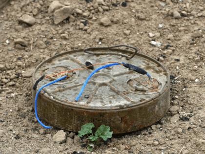 This picture taken on March 24, 2019 shows a discarded landmine lying on the ground in the