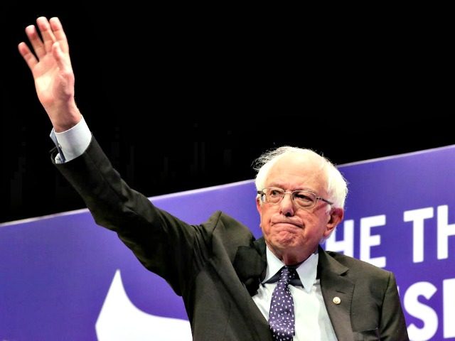 Democratic presidential candidate Sen. Bernie Sanders, I-Vt., waves as he attends a presid