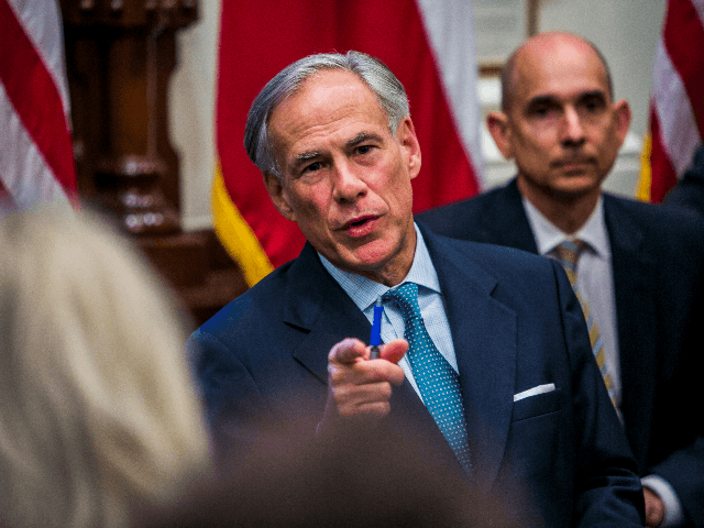 Texas Governor Greg Abbott holds a roundtable discussion with victims, family, and friends affected by the Santa Fe, Texas school shooting at the state capital on May 24, 2018 in Austin, Texas. Representatives from Sutherland Springs, Alpine, and Killeen were also invited and address the governor. (Photo by Drew Anthony …