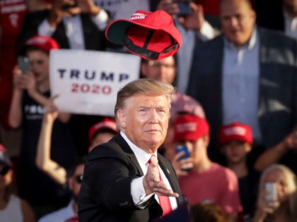 U.S. President Donald Trump tosses a hat into the crowd as he arrives for a 'Make America Great Again' campaign rally at Williamsport Regional Airport, May 20, 2019 in Montoursville, Pennsylvania. Trump is making a trip to the swing state to drum up Republican support on the eve of a …