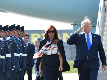 US President Donald Trump (R) and US First Lady Melania Trump (L) walk on the tarmac after disembarking Air Force One at Stansted Airport, north of London on June 3, 2018, as they begin a three-day State Visit to the UK. - Britain rolled out the red carpet for US …