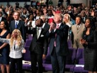Republican presidential nominee Donald Trump isshown during a church service at Great Faith Ministries, Saturday, Sept. 3, 2016, in Detroit. (AP Photo/Evan Vucci)