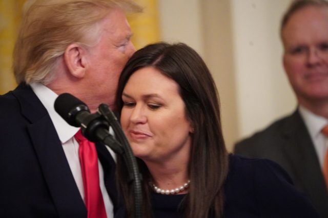 Outgoing White House Press Secretary Sarah Huckabee Sanders hugs US President Donald Trump during a second chance hiring and criminal justice reform event in the East Room of the White House in Washington, DC, June 13, 2019. - President Donald Trump on Thursday made the surprise announcement of the departure …