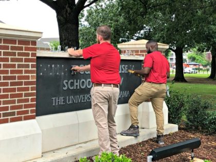 University of Alabama employees remove the name of Hugh F. Culverhouse Jr. off the School of Law sign in Tuscaloosa, Ala., Friday, June 7, 2019. The University of Alabama board of trustees voted Friday to give back a $26.5 million donation to a philanthropist Hugh F. Culverhouse Jr., who recently …