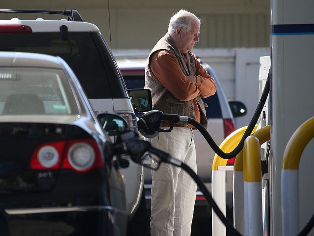 MILL VALLEY, CA - MARCH 03: A customer pumps gasoline into his car at an Arco gas station on March 3, 2015 in Mill Valley, California. U.S. gas prices have surged an average of 39 cents in the past 35 days as a result of the price of crude oil …