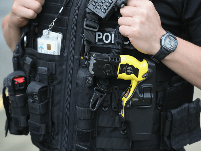 BIRSTALL, UNITED KINGDOM - JUNE 17: Armed police stand guard near to the scene of the murd