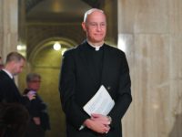 Basilica of the National Shrine of the Immaculate Conception Rector Monsignor Walter Rossi arrives for a press conference to introduce Notre Dame de Paris organist Johann Vexo in the Basilica in Washington, DC on April 25, 2019. - The Basilica will be hosting a concert to benefit the Cathedral of …