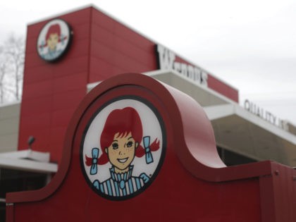 This March 17, 2014, file photo shows a Wendy's logo outside a Wendy's restaurant in Pittsburgh. Wendy's reports financial results Wednesday, Feb. 21, 2018. (AP Photo/Gene J. Puskar)