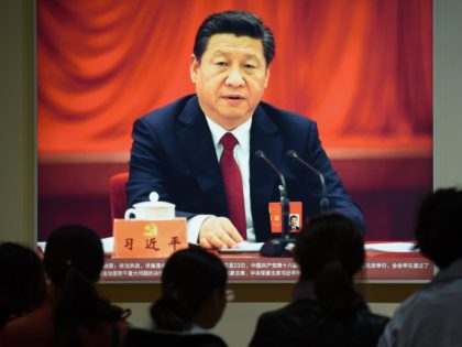 This picture taken on October 10, 2017 shows a portrait of Chinese President Xi Jinping at an exhibition showcasing China's progress in the past five years at the Beijing Exhibition Center. China's police and censorship organs have kicked into high gear to ensure that the party's week-long, twice-a-decade congress goes …