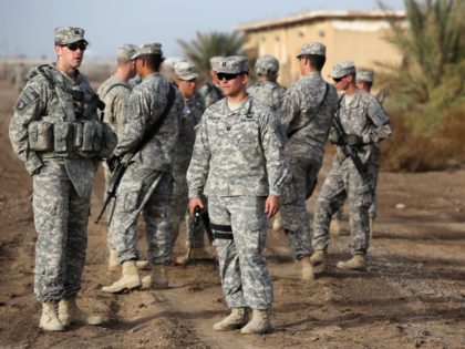 American trainers take a break as they train Iraqi soldier on approaching and clearing buildings at the Taji base complex, which hosts Iraqi and US troops and is located north of the capital Baghdad, on January 7, 2015. Taji is one of an eventual five sites from which the US …