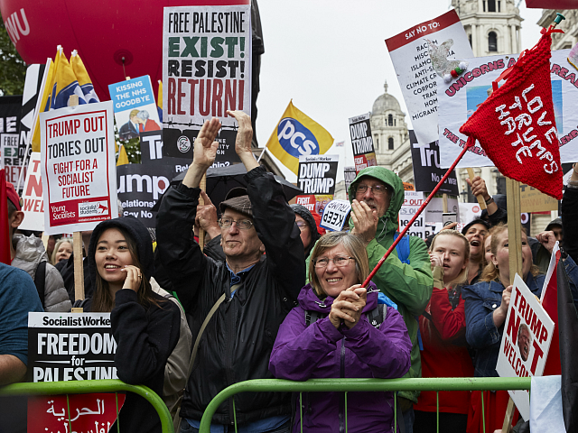 LONDON, UNITED KINGDOM - JUNE 4: Anti-Trump protestors demonstrate in Whitehall on June 4, 2019 in London, England. The second day of President Trump's state visit to the United Kingdom was met by further protests in London, as he met with outgoing Prime Minister Theresa May and members of her …