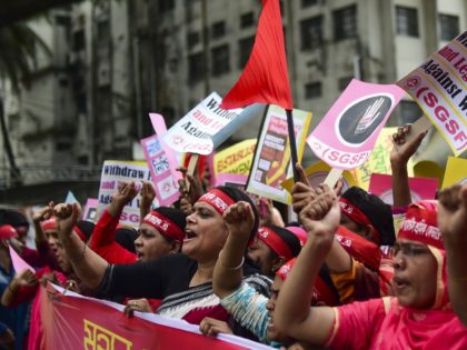 Bangladeshi activists and workers take part in a May Day or International Workers' Day protest in Dhaka on May 1, 2019. - Activists around the world mark international workers' day with marches demanding better working conditions, more jobs and higher wages. (Photo by MUNIR UZ ZAMAN / AFP) (Photo credit …