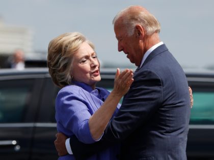 Democratic presidential candidate Hillary Clinton greets Vice President Joe Biden on the tarmac at Wilkes-Barre/Scranton International Airport in Avoca, Pa., Monday, Aug. 15, 2016, before traveling together to a campaign event in Scranton, Pa. (AP Photo/Carolyn Kaster)