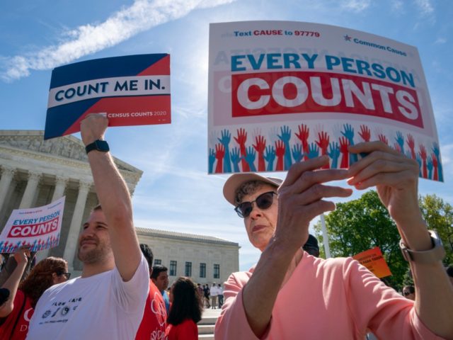Immigration activists rally outside the Supreme Court as the justices hear arguments over the Trump administration's plan to ask about citizenship on the 2020 census, in Washington, Tuesday, April 23, 2019. Critics say the citizenship question on the census will inhibit responses from immigrant-heavy communities that are worried the information …