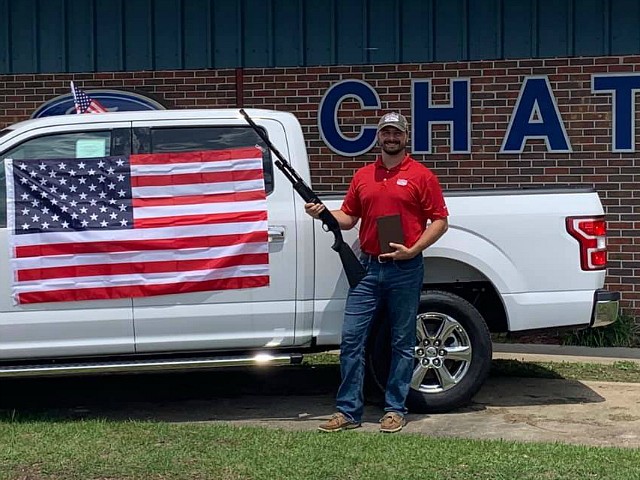 Car Dealership: Free Bible, Shotgun, and Flag for Fourth of July Buyers