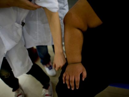 In this picture taken on October 11, 2011, a child's arm (R) is seen during a weight loss program at a hospital in Beijing on October 11, 2011. A Chinese National Task Force on childhood obesity found that almost one in five children under seven are overweight in China, and …
