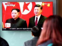 SEOUL, SOUTH KOREA - MARCH 28: South Koreans watch a television broadcast reporting the North Korean leader Kim Jong-un meet Chinese President Xi Jinping at Seoul Railway Station on March 28, 2018 in Seoul, South Korea. (Photo by Chung Sung-Jun/Getty Images)
