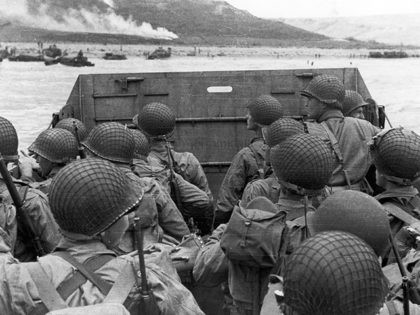 American assault troops in a landing craft huddle behind the shield 06 June 1944 approaching Utah Beach while Allied forces are storming the Normandy beaches on D-Day. D-Day, 06 June 1944 is still one of the world's most gut-wrenching and consequential battles, as the Allied landing in Normandy led to …