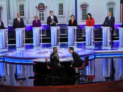 MIAMI, FLORIDA - JUNE 26: Chuck Todd of NBC News and Rachel Maddow of MSNBC and candidates react to technical difficulties during the first night of the Democratic presidential debate on June 26, 2019 in Miami, Florida. A field of 20 Democratic presidential candidates was split into two groups of …