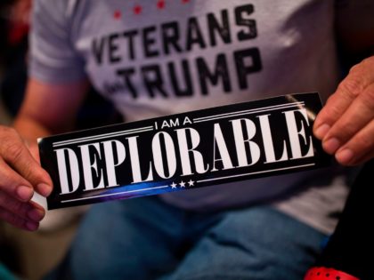 TOPSHOT - A supporter of Republican presidential candidate Donald Trump shows a bumper sticker reading "I am a Deplorable" at Mohegan Sun Arena in Wilkes-Barre, Pennsylvania on October 10, 2016. / AFP PHOTO / DOMINICK REUTER (Photo credit should read DOMINICK REUTER/AFP/Getty Images)