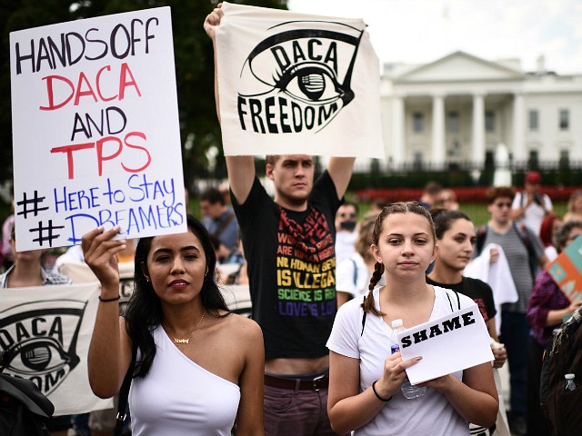 Immigrants and supporters demonstrate during a rally in support of the Deferred Action for Childhood Arrivals (DACA) in front of the White House on September 5, 2017 in Washington DC. US President Donald Trump has rescinded the program, ending amnesty for 800,000 young immigrants brought to the US illegally as minors and who are largely integrated into US society. US Attorney General Jeff Sessions made the announcement in a press conference at the Justice Department. / AFP PHOTO / Eric BARADAT (Photo credit should read ERIC BARADAT/AFP/Getty Images)