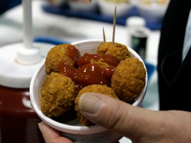 Pennsylvania Gov. Ed Rendell holds holds a container of deep-fried mushrooms with ketchup