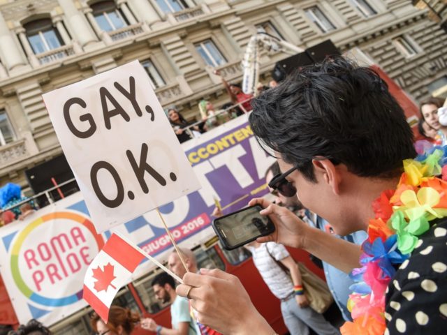 People take part in the annual Gay Pride Parade (LGBT), in downtown Rome on June 11, 2016.