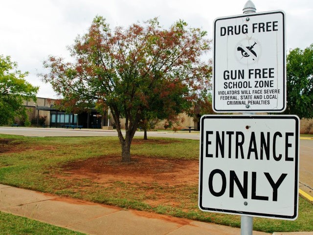 A sign declaring Stillwater Junior High School as a drug free and gun free zone is picture
