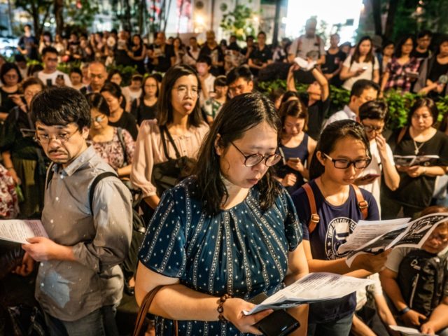 HONG KONG, HONG KONG - JUNE 19: Hundreds of residents gather around for a prayer meeting o