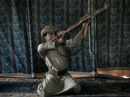 Kahlan, a 12-year-old former child soldier, demonstrates how to use a weapon, at a camp for displaced persons where he took shelter with his family, in Marib, Yemen in this July 27, 2018 photo. Houthi rebels took Kahlan and his classmates, promising to give them new school bags, but instead …