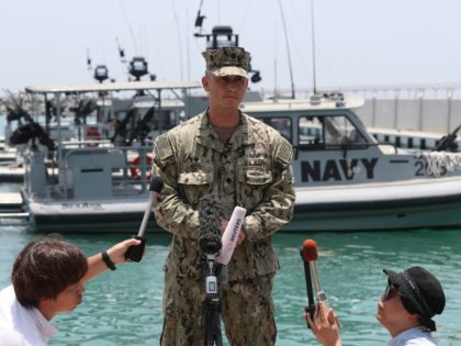 Cmdr. Sean Kido of the U.S. Navy's 5th Fleet talks to journalists at a 5th Fleet Base near Fujairah, United Arab Emirates, Wednesday, June 19, 2019. Cmdr. Kido said Wednesday that damage done last week to the Kokaku Courageous was "not consistent with an external flying object hitting the ship." …