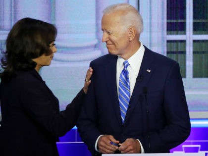 MIAMI, FLORIDA - JUNE 27: Sen. Kamala Harris (D-CA) touches former Vice President Joe Biden during the second night of the first Democratic presidential debate on June 27, 2019 in Miami, Florida. A field of 20 Democratic presidential candidates was split into two groups of 10 for the first debate …