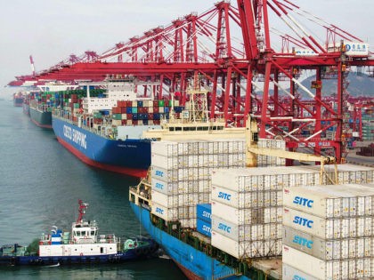 Cargo ships berth at a port in Qingdao in China's eastern Shandong province on May 8, 2019
