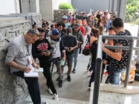 Asylum seekers queue for a turn for an asylum appointment with US authorities in Ciudad Juarez, Chihuahua state, Mexico, on May 31, 2019.