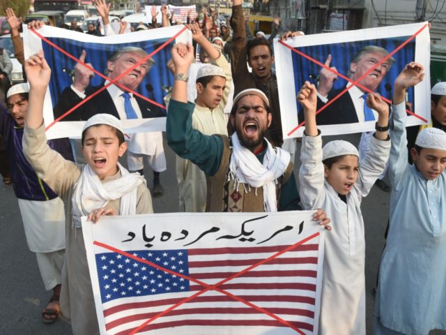 Pakistani demonstrators take part in a protest against US aid cuts in Lahore on January 5,