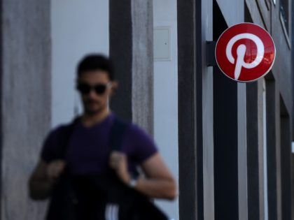 SAN FRANCISCO, CALIFORNIA - APRIL 09: A pedestrian walks by the Pinterest headquarters on April 09, 2019 in San Francisco, California. Social sharing site Pinterest is preparing for its initial public offering (IPO) and is planning to offer 75 million shares with a listing price of $15 to $17 per …
