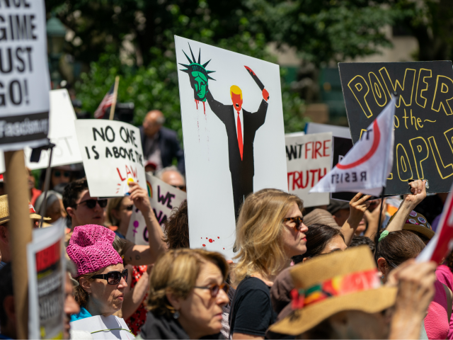 NEW YORK, NY - JUNE 15: Protestors attend a demonstration calling for the impeachment of U