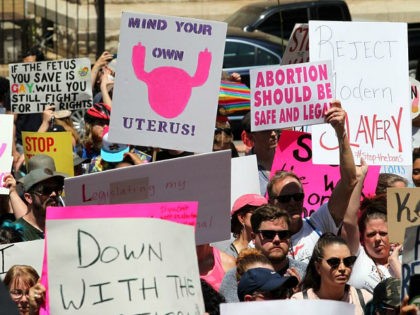 Abortion rights advocates rally in front of the Georgia State Capitol in Atlanta to protes