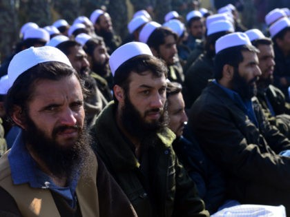 TO GO WITH Afghanistan-unrest-prison,FOCUS by Ben Sheppard In this picture taken on January 4 ,2013, released Taliban prisoners sit on chairs as they listen to speeches during a ceremony in Pul-e-Charkhi jail. With tears streaming down their faces, scores of suspected Afghan militants embraced waiting relatives and walked to freedom …