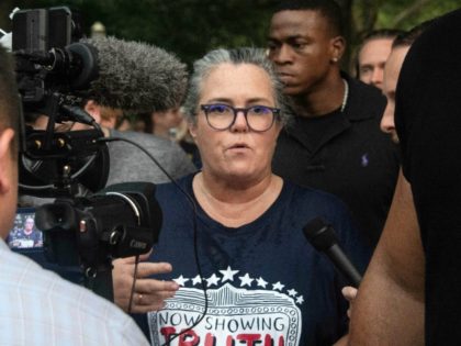 US comedian Rosie O'Donnell speaks to reporters as she leaves a protest against US President Donald Trump in front of the White House in Washington, DC, on August 6, 2018. (Photo by NICHOLAS KAMM / AFP) (Photo credit should read NICHOLAS KAMM/AFP/Getty Images)
