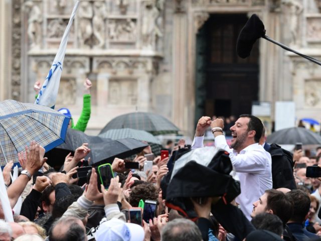 Italian Deputy Prime Minister and Interior Minister Matteo Salvini (R) greets supporters d
