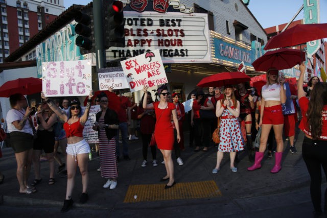 People chant as they march in support of sex workers, Sunday, June 2, 2019, in Las Vegas.