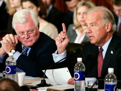 WASHINGTON - SEPTEMBER 12: Sen. Joseph Biden (R) (D-DE) makes opening remarks during the first day of confirmation hearings for Supreme Court Chief Justice nominee John Roberts as Sen. Ted Kennedy (L) (D-MA) looks on September 12, 2005 at the historic Russell Senate Office Building Caucus Room in Washington, DC. …